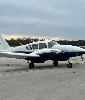 A small airplane sitting on top of an airport runway.