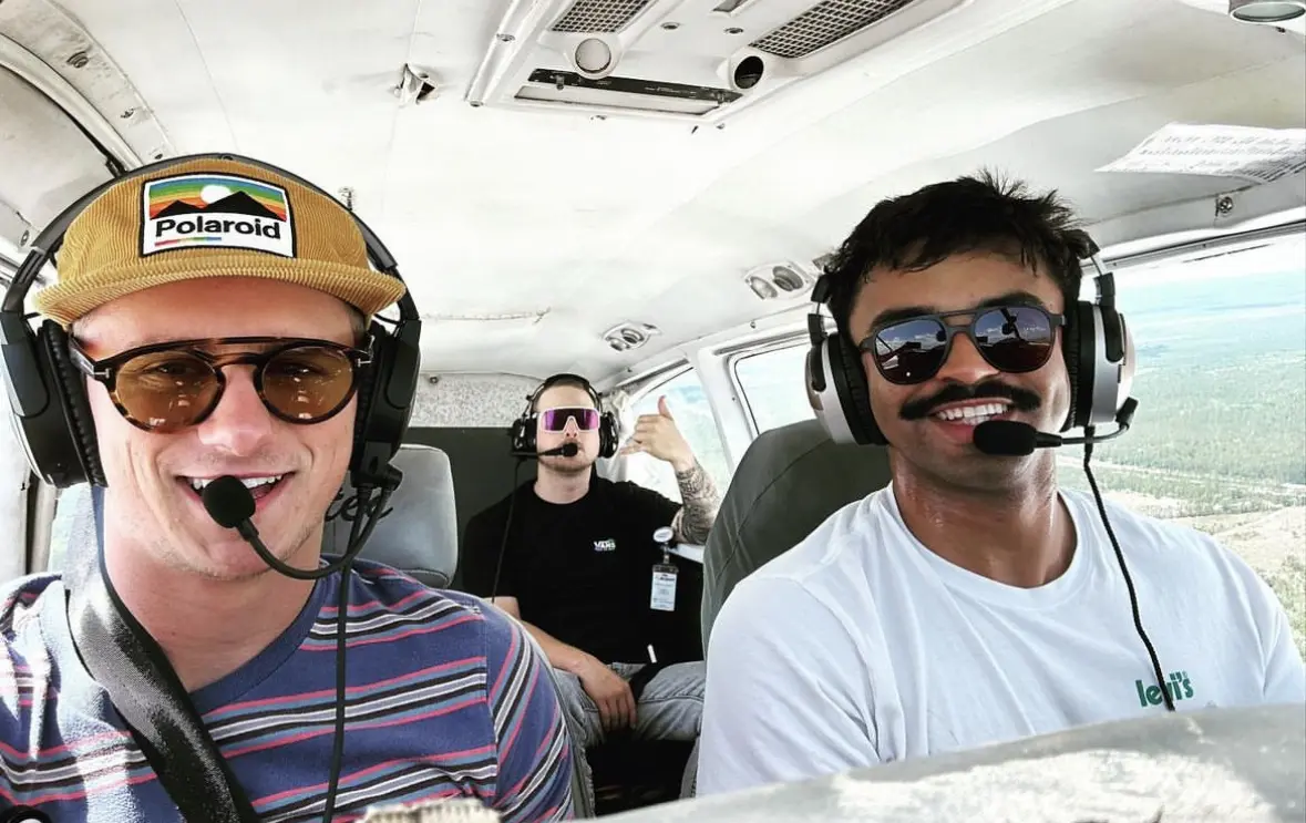 Three men flying in a plane