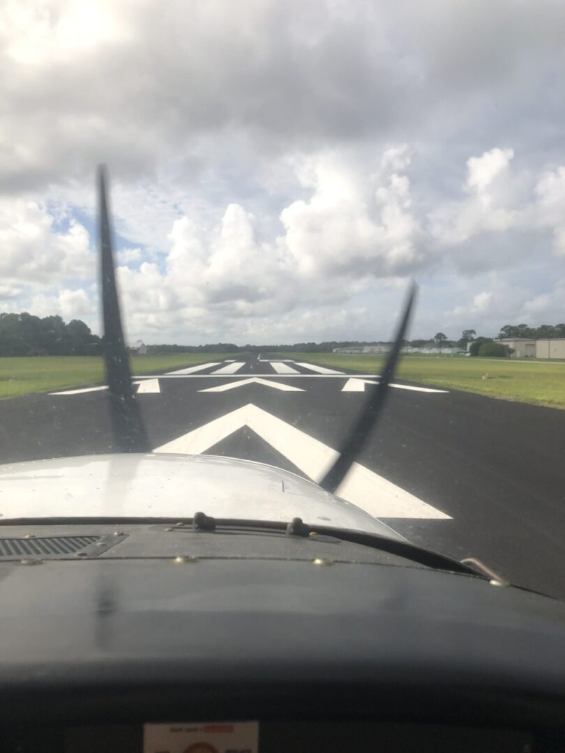 Front view of small aircraft on runway